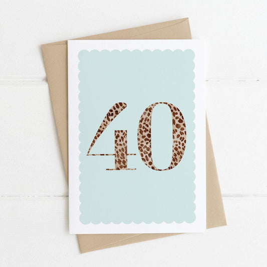 A 40th birthday card with animal print number 40 on a pastel blue background, with a kraft brown envelope
